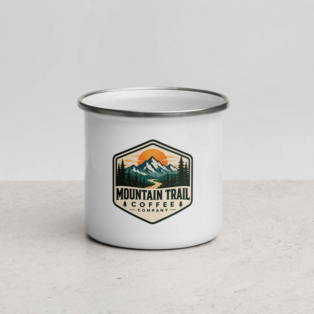Enamel Mug with a white enamel body, silver rim, and colorful mountain trail coffee company badge on the front.